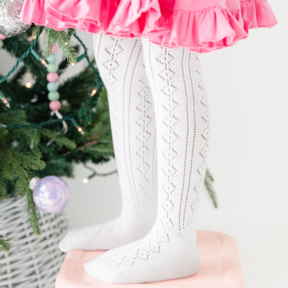 girls white pointelle knit tights with pink dress