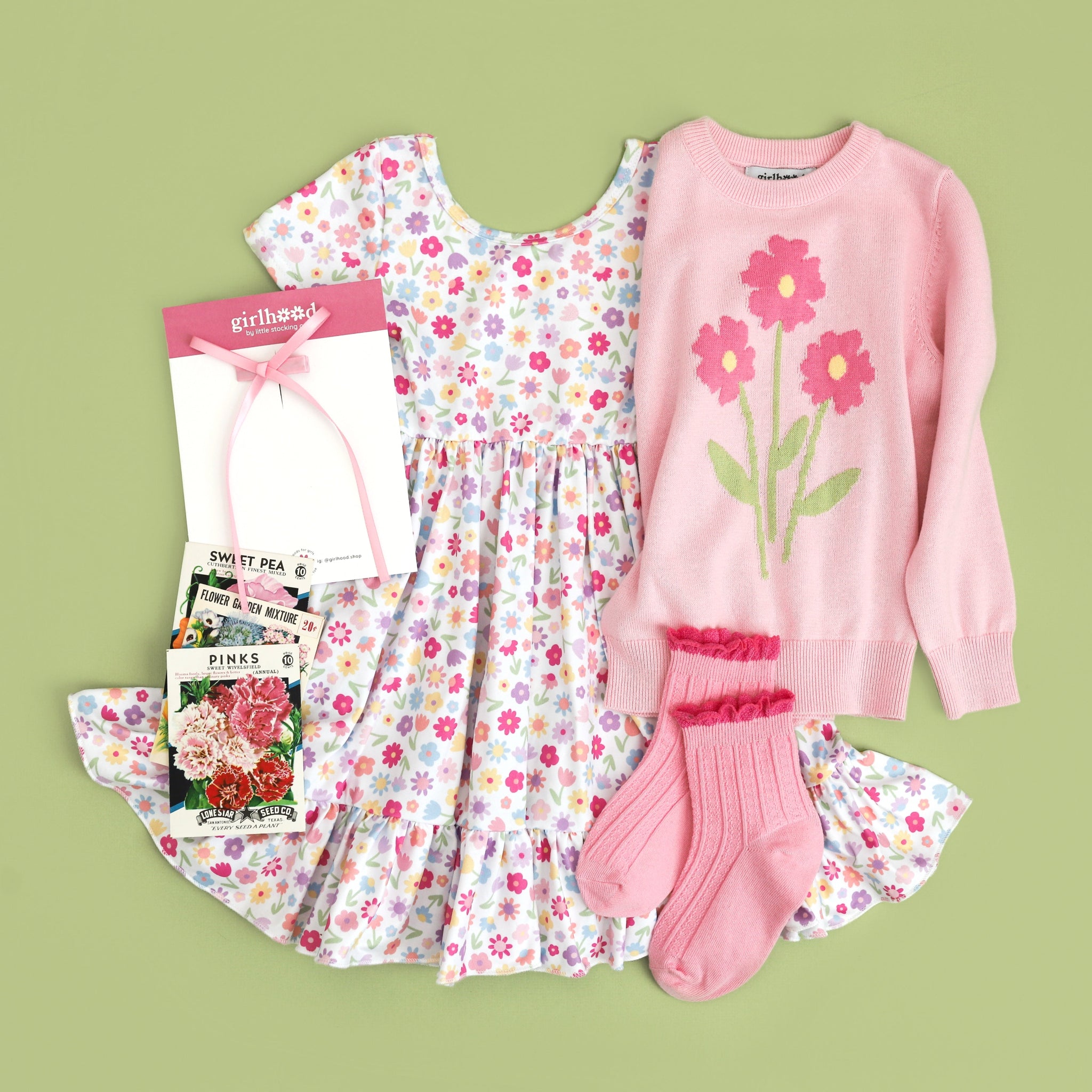 girls complete spring outfit with white floral dress, pink floral sweater and matching pink socks and bow