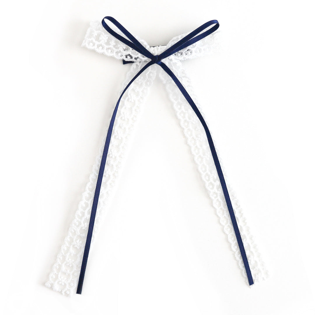 girl's white lace and navy ribbon long tail bow on alligator clip