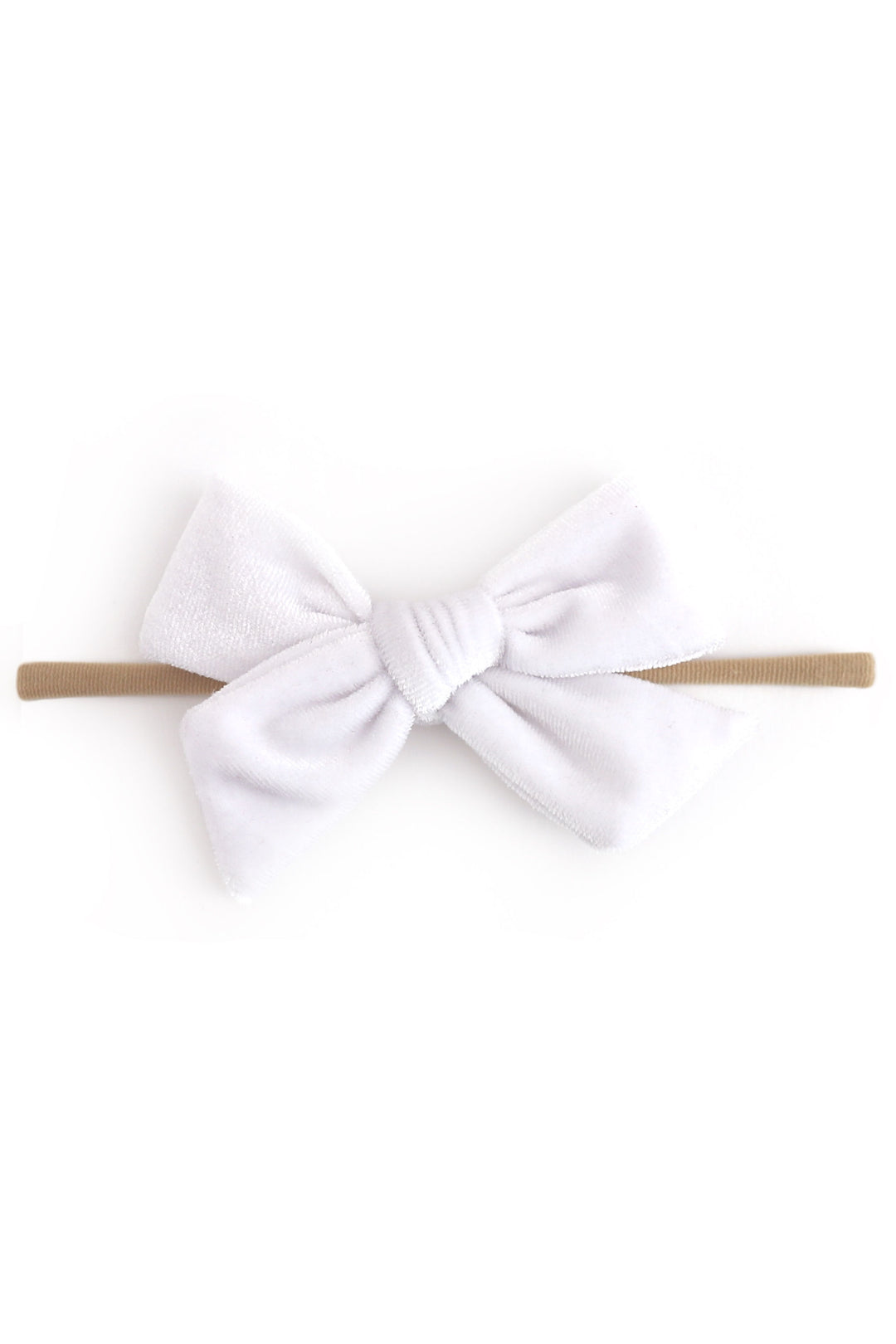 A white velvet baby bow headband on a solid white background.