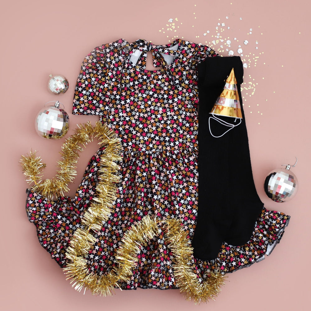 confetti stars twirl dress paired with black cable knit tights