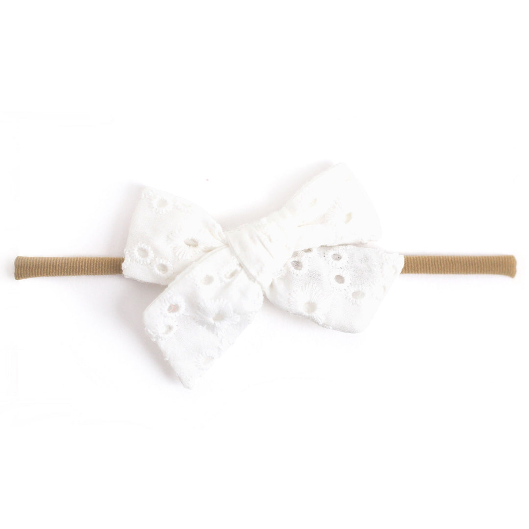 white eyelet fabric baby bow on nylon headband